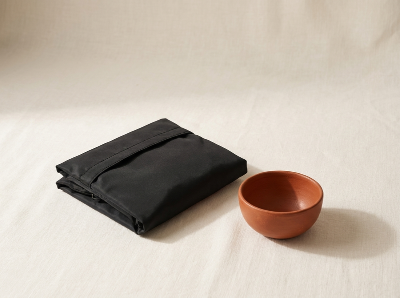 Plio folded flat on linen, guarantee section still life